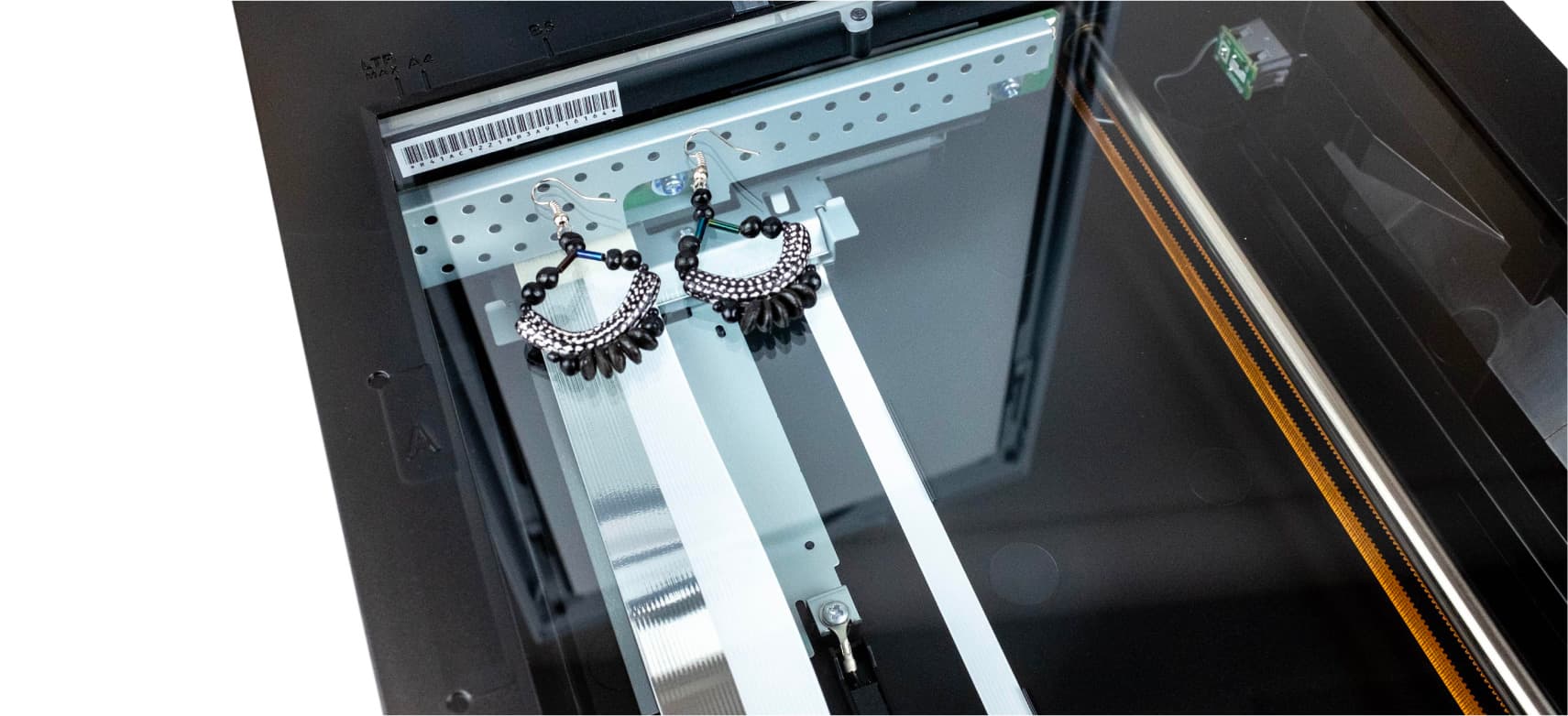 Earrings placed on scanner bed